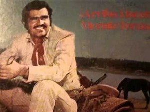 con golpes de pecho...Vicente Fernandez