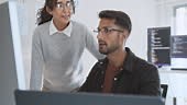 Hispanic Latin American couple, software engineer developer use...