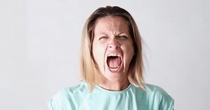 Portrait of angry emotionally nervous screaming woman. Hatred and psychological emotional female breakdown concept