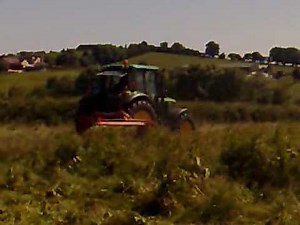 john deere mowing with taarup