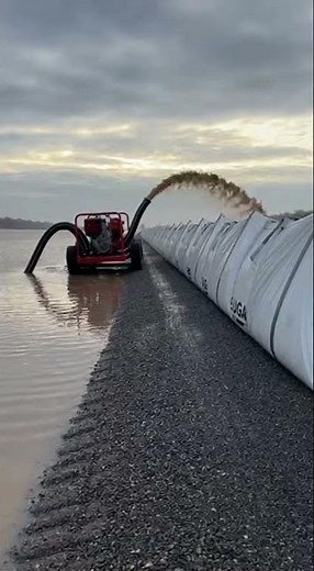 The Levee Was Failing. They Dropped 13,000-Pound Bags From a Crane. The Water Stopped.
