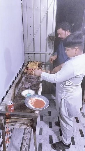 Delicious Skewered Meat Cooking in the Kitchen