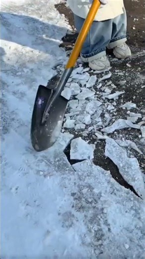 Breaking Ice Layers Using a Shovel #shorts