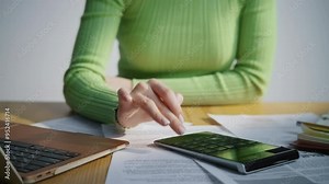 Closeup woman touching computer touchpad typing calculator in office cabinet