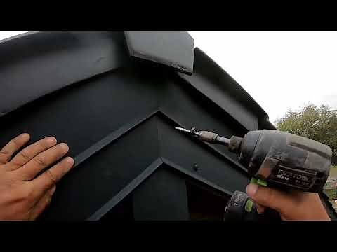 Sheet metal work on rafters.