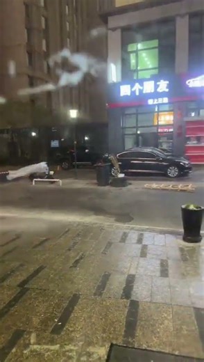 Strong winds push outdoor objects toward building in Xinjiang, China