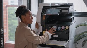 Businessman helping woman colleague using a photocopier machine in office. Photocopy machine was broken. Photocopier or printer has error