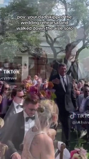 A video of a wedding went viral after the bride's father accidentally walked down the aisle alone. The bride, Brooke McQueen, laughed as her father was gently reminded of his mistake. After realizing the issue, he returned to walk his daughter down the aisle. | Fox 9