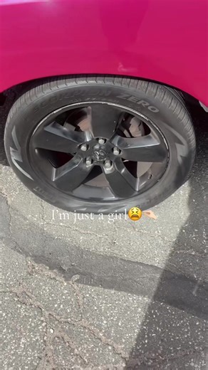 Girl Struggles with a Flat Tire