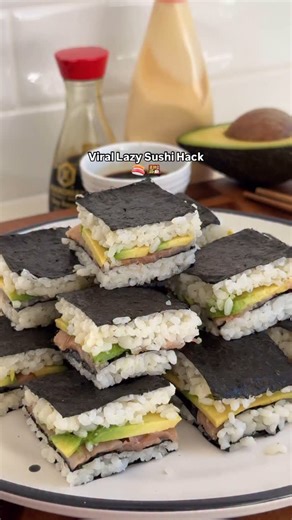 equ on Instagram: "Craving sushi without the effort? You’re in the right place 🍣 Follow @joinequ for more simple recipes. This lazy sushi stack hits all the right notes: salty, umami and, loaded with flavour. Layer everything in a tray and enjoy sushi bites without the fuss. Ingredients 3 x Sheets Nori 200g x Sushi Rice (uncooked weight) 20mL x Mirin 15g White Sugar 200g Avocado (sliced or mashed) 100g Sliced Smoked Salmon 60g Reduced Fat Kewpie Mayonnaise Method 1. Line a square baking dish wi