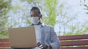 Young Man Mask Working On Laptop Stock Footage Video (100% Royalty-free) 1077345122 | Shutterstock