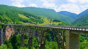 Durdevica Tara Bridge, also known as the bridge of anti fascist, hero lieutenant Bozhidar Zugic, is a concrete arch bridge over the Tara Canyon River in northern Montenegro.