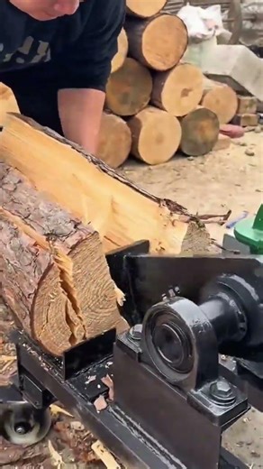 the process of splitting wood into several parts using a special machine