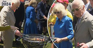 King Charles and Queen Camilla turn sausages on the barbecue