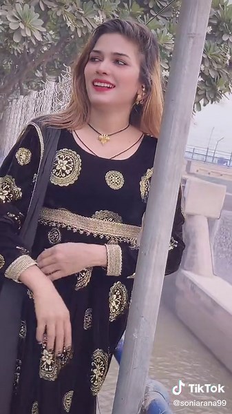 Intricate Metal Fence Designs by Calm Water