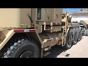 Oshkosh M1070 off road transport hauling Komatsu 375 dozer