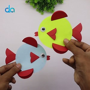 In this enjoyable tutorial, we'll guide you through the process of creating a simple origami paper fish that is perfect for kids. Let your little ones dive into the world of paper crafting as they learn to fold and create their very own colorful fish. #diy #craft #origami | DIY Crafts & Art
