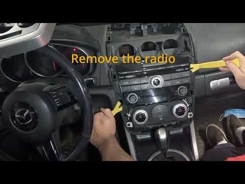 Parasitic drain part 3, radio, climate unit, and information display removal for a 2008 CX-7