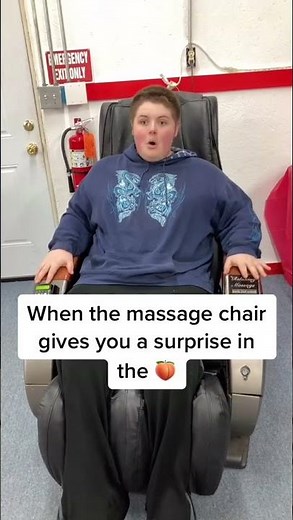 Kid getting a massage in chair gets an unexpected surprise.