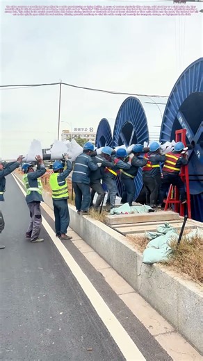 Manual Threading: The Collective Lift to Spool Massive Cable