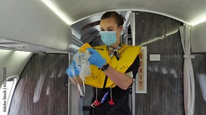 Oxygen Mask Safety Demo Prior Departure by Stewardess with Mouth Mask.