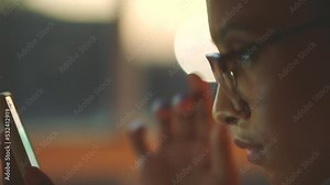 A woman using digital UI smartphone for email, social media app and internet web search. A close up of young, black and focused female scrolling on cellphone screen streaming, working and texting.