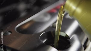 Car oil is poured into the engine. 4k