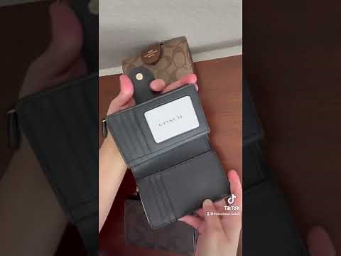 Coach Medium corner zip wallet in Signature canvass