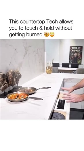 rhrealtyco on Instagram: "Moments ago, food was actively cooking here, and now the surface is cool enough to touch. That’s because the countertop itself never heats up—this system uses invisible induction, transferring energy directly into the cookware, not the stone surface. When the pan is removed, heat stops instantly with no residual warmth. When cooking is finished, there’s nothing to cool down, nothing visible, and no exposed burners. The countertop returns to looking exactly as it did bef