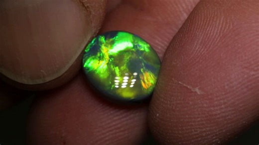 4.5K views · 127 reactions | You might need sunglasses for this one!  Blazing, luminous, and brilliantly bright, this Black Opal dazzles with iridescent green and gold flashes across its face. Perfect for making a bold statement in a ring setting 4.10ct gem black opal 12.1×10.3×5.3mm https://blackopaldirect.com/product/opal/black-opal/4-10-ct-gem-black-opal-12-1x10-3x5-3mm/ | Black Opal Direct | Facebook