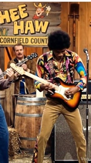 unknown guy with colorful clothes appears on Hee Haw