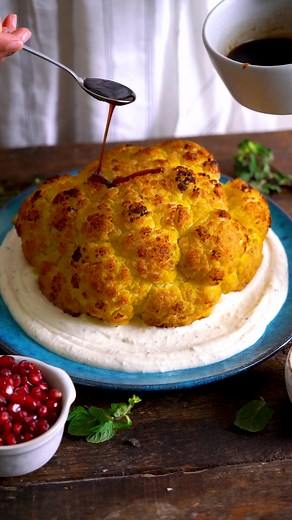 This whole roasted cauliflower recipe has everything you’re looking for in a vegetarian main dish. It has fresh, bold, flavors, and a variety of textures! https://themeddish.com/Whole-Roasted-Cauliflower | The Mediterranean Dish