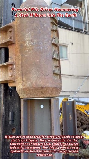 Powerful Pile Driver Hammering A Steel H Beam Into The Earth