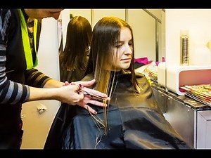Long haired blonde woman getting a romantic bob haircut for holidays