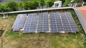 A rooftop solar array is set up, showcasing eco-friendly energy solutions in the community