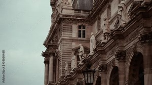 Statues on the outside of the Musem du Louvre building in Paris France