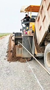 This is a curb-forming machine for shoulder work. | Metzgerei Ogunquit Studio