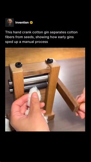 The hand crank cotton gin shown in the video uses simple mechanical motion to separate cotton fibers from their seeds. As the crank turns, fibers are pulled through narrow slots while the larger seeds are held back, completing in seconds what once took much longer by hand. Before machines like this, removing seeds from cotton was slow and labor intensive, often done fiber by fiber. Early cotton gins dramatically increased efficiency, allowing farmers to process far more cotton in a single day an