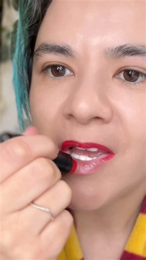 Applying red lipstick 💄
