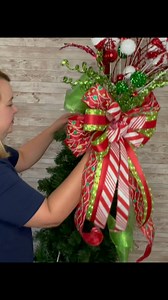 How to put a Christmas Tree Topper in a Christmas tree! 🎄 Have you ever wondered how to attach a tree topper bow securely to the top of a Christmas tree? Follow these simple instructions to make sure your tree topper looks great and will stay put throughout the holidays season! 😊 #3littlegreenwoods #etsyseller #treetopperbow #treetopperbowtutorial #christmastreetopperbow #christmastreetopper | 3 Little Greenwoods Creations