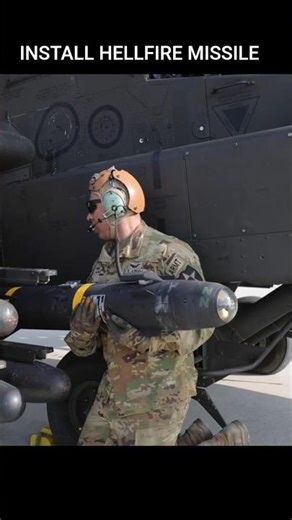 AIRMEN INSTALL HELLFIRE MISSILE
