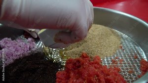 preparing Turkish cig kofte with traditional methods