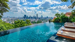 Download A swimming pool with lounge chairs and a view of the city for free