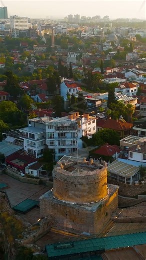 Vertical video. Antalya, Turkey. Aerial view of Hidirlik Tower within Karaalioglu Park landscape ...