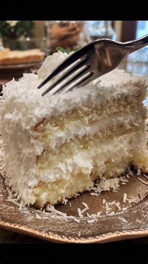 Here’s a luscious Italian Cream Cake recipe – rich, moist, and loaded with coconut and pecans, topped with a fluffy cream cheese frosting. The version in your image looks like a variation using all-white layers, so here's a version without the usual pecans and with all the coconut-forward elegance. | Mom's Kitchen Notes
