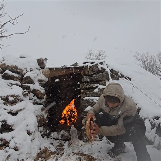 Dawid Outdoor Adventures on Instagram: "A Warm Shelter in a Winter Storm Snowstorm outside. Fire inside. Quiet cooking by the fireplace. Sound on 🔊 #nature #winter #fire #outdoor #cooking"