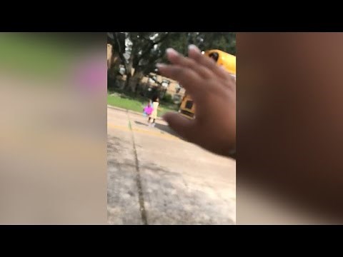 Car nearly hits hit child getting off school bus