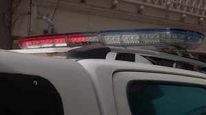Download Flashing lights of police cars closeup. for free