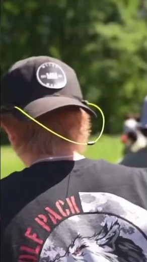 Braydon Price picks flowers on the side of Highway