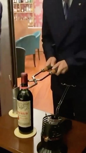 BEAUTIFUL CUISINES on Instagram: "Learn from @luxandgo as she shows you the tonging method used to open Port wine! 🍷 The Port tong method uses long-handled tongs that are heated and closed around the neck of the bottle just below the cork. After a few minutes, the tongs are then released and a cloth or brush dipped in cold water will take its place. The temperature change will cause the glass to break and the whole top of the bottle, cork and all, can be removed. The wine is then decanted throu